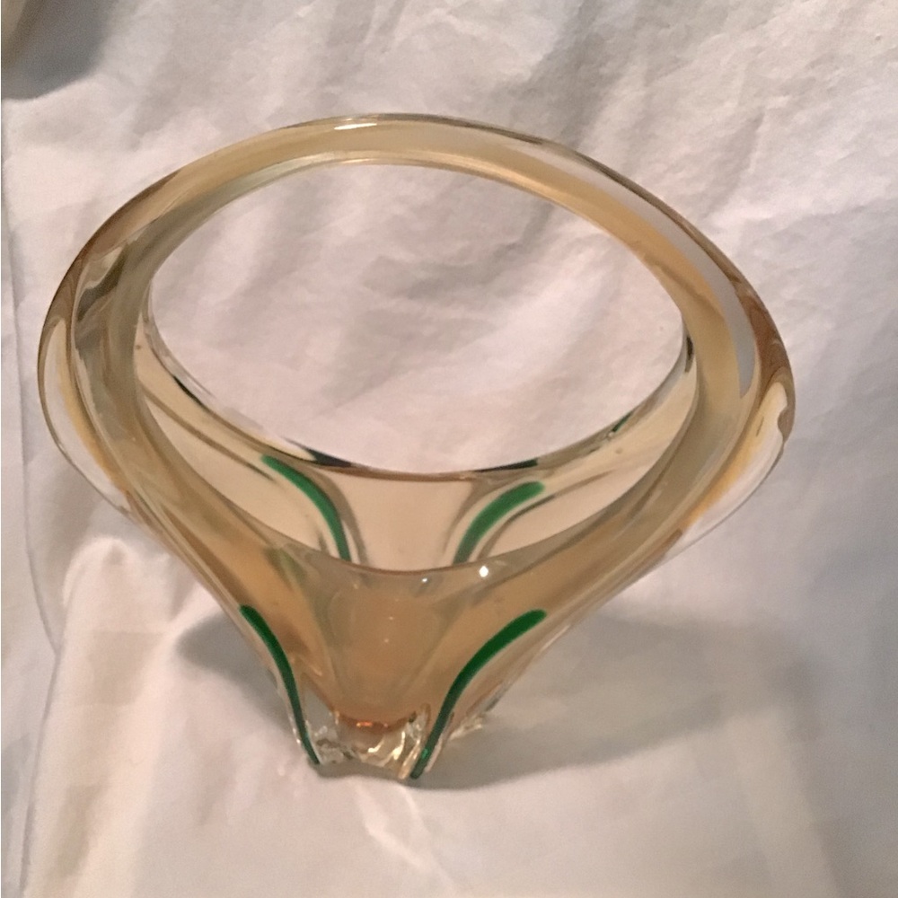 Mid-century, modern influence glass blown with occlusions and bubbles.